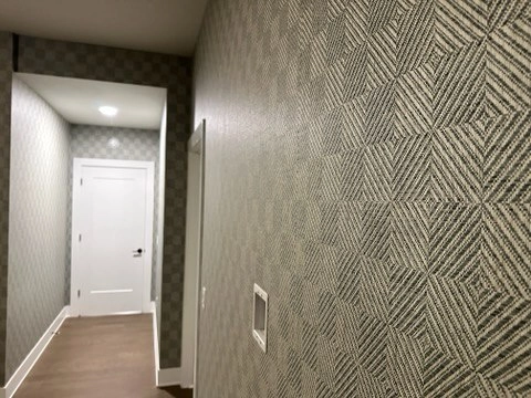 Bedroom with elegant wallpaper feature wall